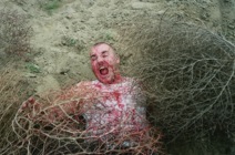 Gino surrounded by tumbleweeds in a scene from the film